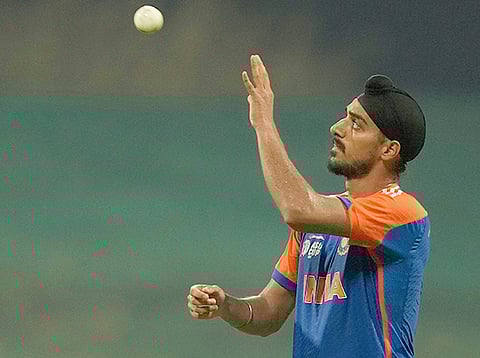 India's Arshdeep Singh catch a ball during the Asia Cup cricket match against Oman at Zayed Cricket Stadium in Abu Dhabi, on Friday, September 19, 2025.