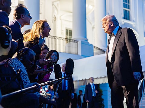 US President Donald Trump speaks to members of the media on the South Lawn of the White House in Washington, DC, on Saturday, September 20, 2025.