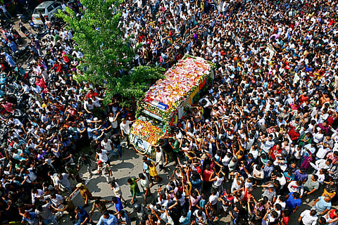Fans gather to pay their respect to the mortal remains of Bollywood musician Zubeen Garg at Jalukbari in Guwahati on September 21, 2025.