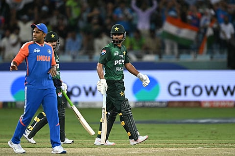 Pakistan's Fakhar Zaman walks back to the pavilion after his dismissal during the Asia Cup 2025 Super Four match at the Dubai International Stadium in Dubai on September 21, 2025.