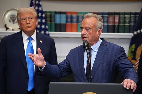 US President Donald Trump (L) looks on as Health and Human Services Secretary Robert F. Kennedy Jr. (R) answers questions after delivering an announcement on “significant medical and scientific findings for America’s children” in the Roosevelt Room of the White House on September 22, 2025 in Washington, DC. Federal health officials suggested a link between the use of acetaminophen during pregnancy as a risk for autism, although many health agencies have noted inconclusive results in the research.