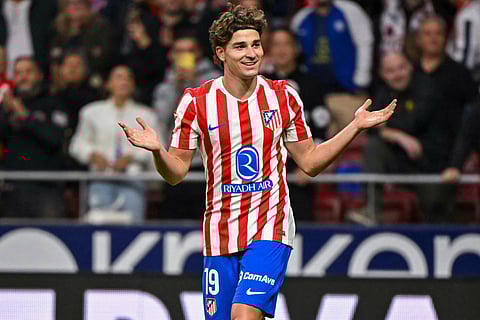 Atletico Madrid's Argentine forward #19 Julian Alvarez celebrates after scoring their third goal during the Spanish league football match between Club Atletico de Madrid and Rayo Vallecano de Madrid at the Metropolitano stadium in Madrid on September 24, 2025.