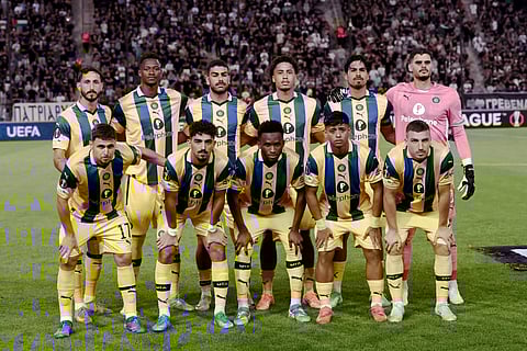 Maccabi team players pose prior to the start of a UEFA Europa League football match.