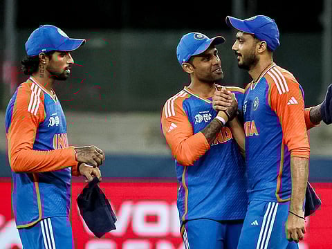 India's captain Suryakumar Yadav (C) celebrates with teammates after their win at the end of the Asia Cup 2025 Super Four T20 match against Bangladesh at the Dubai International Stadium on September 24, 2025.