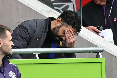 Manchester United's Portuguese head coach Ruben Amorim reacts in his seat during the English Premier League football match between Brentford and Manchester United at the Gtech Community Stadium in London on September 27, 2025.