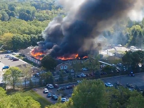 Massive flames and smoke rise from The Church of Jesus Christ of Latter-day Saints in Grand Blanc, about 50 miles north of Detroit.