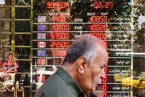 An electronic board displays currency exchange rates in Ferdowsi Square in the Iranian capital Tehran on September 28, 2025,.