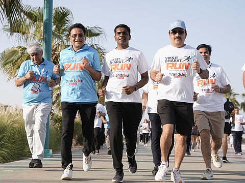 Satish Kumar Sivan (third from left) and Jitendra Vaidya (second from left) and other community members during the Viksit Bharat Run in Dubai on Sunday.