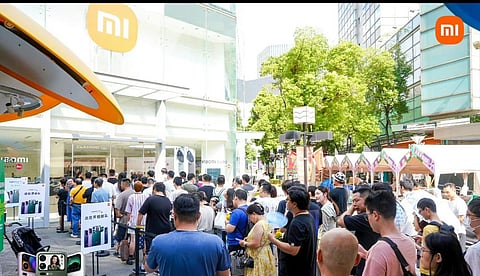 People form a queue outside a Xiaomi store in China. Packed with powerful specs and standout features that position it as a strong competitor to top-tier devices, the flagship Xiaomi 17 Pro Max makes it a strong contender to iPhone 17 Pro Max.