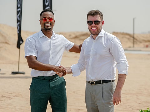 Patrice Evra, global football champion (left) ,with Andrei Charapenak, CEO of Major Developments (right).