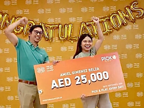 Amiel Gimenez Belza and his wife celebrate the win.