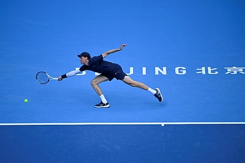 Italy's Jannik Sinner hits a return to Hungary Fabian Marozsan during their men's single quarter-final match at the China Open tennis tournament in Beijing on September 29, 2025.