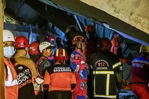 Rescue personnel search for survivors after a building collapsed at an Islamic boarding school in Sidoarjo, East Java province on September 29, 2025, injuring a number of students and trapping several others under the rubble.