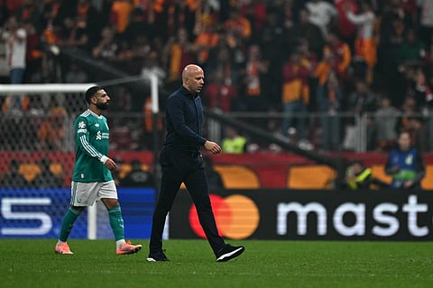 Liverpool's Dutch coach Arne Slot (R) reacts to his teams defeat as he walks off the pitch at the end of the UEFA Champions League first round day 2 football match between Galatasaray (TUR) and Liverpool (ENG) at the Ali Sami Yen Spor Kompleksi in Istanbul on September 17, 2025.