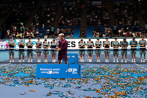 Spain's Carlos Alcaraz celebrates during the award ceremony after winning the men’s singles final match against USA's Taylor Fritz at the ATP Japan Open tennis tournament in Tokyo on September 30, 2025.