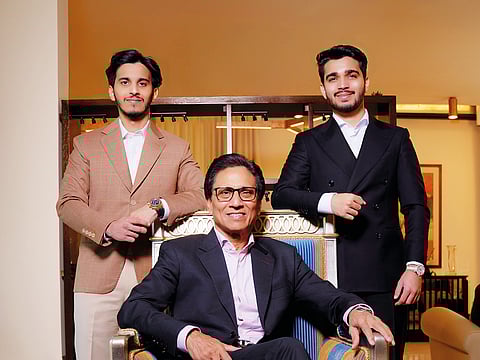 Seated: Tauseef Khan, Founder and Chairman, Dugasta Properties; Standing, from left: Azaan Khan, CEO, and Eifaad Khan, President