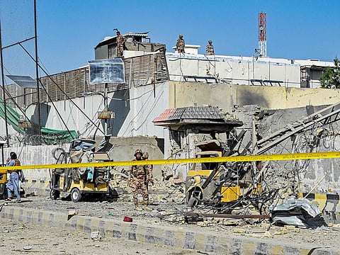 Security personnel inspect an explosion site outside the Frontier Corps (FC) headquarters in Quetta, Pakistan, on September 30, 2025.