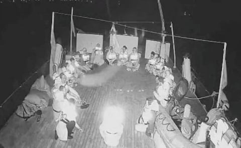 In this handout screenshot taken from live video footage, crew members can be seen sitting in a circle aboard the Gaza-bound "Alma" vessel on Wednesday.