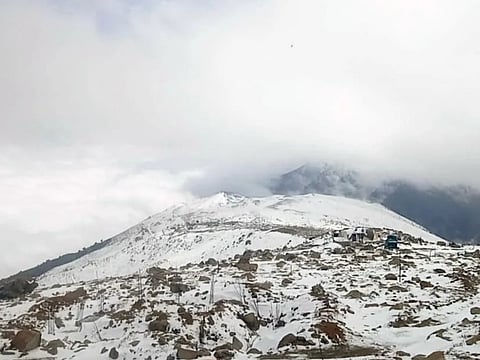 The majestic Afarwat peak in Gulmarg glistens under a fresh blanket of snow, marking the season’s first winter spell in Kashmir.