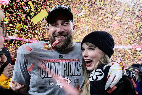 FILE - Travis Kelce, left, and Taylor Swift pose after the AFC Championship NFL football game against the Buffalo Bills, Jan. 26, 2025, in Kansas City, Mo. (AP Photo/Ashley Landis, File)