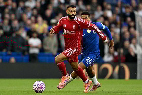 Liverpool's Egyptian striker Mohamed Salah runs with the ball during the English Premier League football match against Chelsea.
