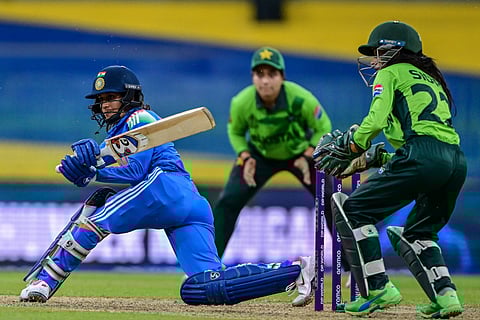 India's Jemimah Rodrigues (L) plays a shot during the ICC Women's Cricket World Cup 2025 one-day international (ODI) match between India and Pakistan at the R. Premadasa International Cricket Stadium in Colombo on October 5, 2025.