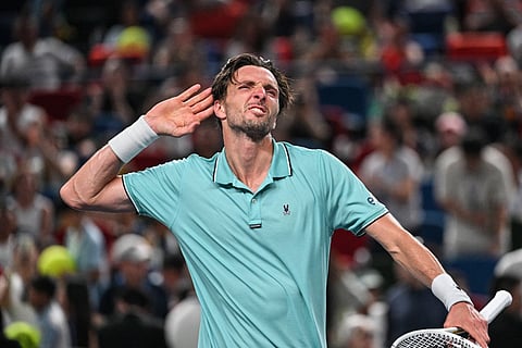 France's Arthur Rinderknech celebrates beating Germany's Alexander Zverev in their men's singles match at the Shanghai Masters tennis tournament in Shanghai on October 6, 2025.