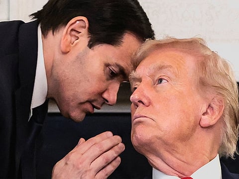 US President Donald Trump and  US Secretary of State Marco Rubio. During a televised meeting, his top diplomat slipped him a note before he turned to the cameras and posted, “BLESSED ARE THE PEACEMAKERS!” on Truth Social.