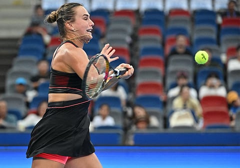 Belarusia’s Aryna Sabalenka hits a return to Slovakia’s Rebecca Sramkova during their women’s singles match at the Wuhan Open tennis tournament in Wuhan, Central China’s Hubei province on October 8, 2025.