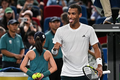 Canada's Felix Auger-Aliassime celebrates after winning against Italy's Lorenzo Musetti during their men's singles match at the Shanghai Masters tennis tournament in Shanghai on October 8, 2025.