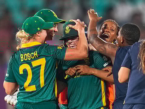 South Africa's Nadine de Klerk, centre, celebrates with teammates after hitting a six to win the ICC Women's Cricket World Cup match against India at ACA-VDCA Cricket Stadium in Visakhapatnam, India, on Thursday, October 9, 2025.