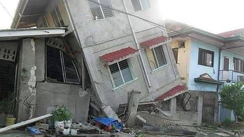A house tilts precariously on its side after a powerful Magtitude 7.5 earthquake struck off the southern Philippines on October 10, 2025, damaging structures, cracking roads, and sending residents scrambling into the streets as aftershocks rippled across the region.