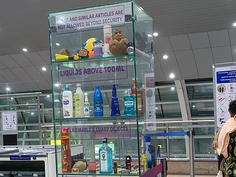 A display cabinet near the screening zone after immigration lists restricted items.