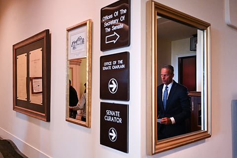 US Senate Majority Leader John Thune, Republican from South Dakota, departs a news conference at the US Captiol on the tenth day of the federal government shutdown on October 10, 2025, in Washington, DC.
