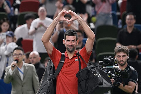 Serbia’s Novak Djokovic acknowledges spectators after losing in his men’s singles semi-final match against Monaco’s Valentin Vacherot at the Shanghai Masters tennis tournament in Shanghai on October 11, 2025.