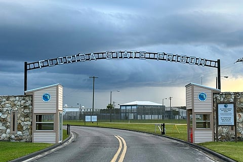 Clouds hover over the entrance of the Florida State Prison in Starke, Florida, August 3, 2023.
