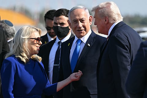 Israel's Prime Minister Benjamin Netanyahu and his wife Sara greet US President Donald Trump (R) upon his arrival at Ben Gurion Airport on the outskirts of Lod near Tel Aviv on October 13, 2025.
