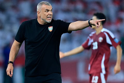 UAE's Romanian coach Cosmin Olaroiu instructs his players during the Fifa World Cup 2026 Asian qualifier football match against Qatar at Jassim Bin Hamad Stadium in Doha on October 14, 2025.