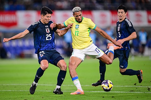 Brazil's midfielder Joelinton (C) shoots the ball during the international football friendly match against Japan at the Tokyo stadium in Chofu, Tokyo prefecture on October 14, 2025.
