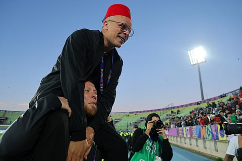 Morocco's head coach Mohamed Ouahbi celebrates his team's victory in the penalty shootout during the 2025 FIFA U-20 World Cup semi-final football match between Morocco and France at the Elias Figueroa Stadium in Valparaiso, Chile on October 15, 2025.