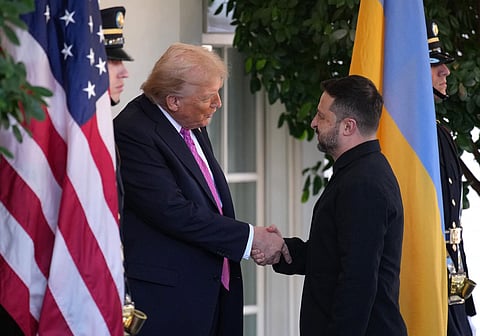 US President Donald Trump (L) greets Ukrainian President Volodymyr Zelensky outside the West Wing of the White House on October 17, 2025, in Washington, DC.