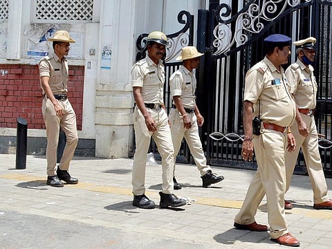 Bengaluru police personnel during the arrest of the accused engineering student.