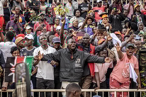 Mourners and supporters of Kenya’s opposition leader and former Prime Minister Raila Odinga react in grief as his coffin arrives during the State Funeral in Nairobi on October 17, 2025.