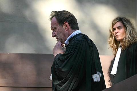 Alexandre Martin (L) and Emmanuelle Franck, lawyers for defendant Cedric Jubillar, leave after the verdict of their client's trial, who was sentenced to 30 years in prison.
