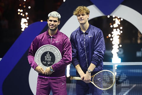 Italy's Jannik Sinner (R) and Spain's Carlos Alcaraz pose for photos at the end of the final of the Six Kings Slam exhibition tennis tournament in Riyadh on October 18, 2025.
