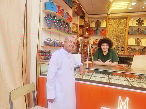 Ali Hossein, and his father who have been running the family business of earrings and necklaces in Global Village since 1996.