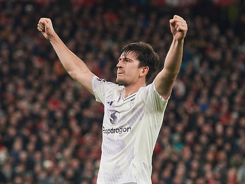 Manchester United's Harry Maguire celebrates after scoring his side's second goal during the English Premier League soccer match between Liverpool and Manchester United in Liverpool, England.