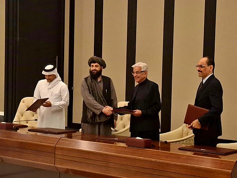 (2nd right) Pakistan Defence Minister Khawaja Asif and his Afghan counterpart Maulvi Muhammad Yaqub Mujahid shakes hand after ceasefire agreement was signed in Doha on Sunday