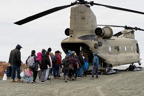 In this photo provided by the Alaska Army National Guard, displaced people are evacuated from Kwigillingok, Alaska, on Thursday, Oct. 16, 2025, following Typhoon Halong that struck Alaska's west coast.
