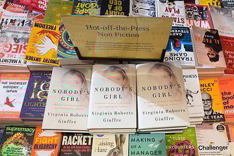 The memoir book of Virginia Giuffre, "Nobody's Girl" is seen among other books in a store and is up for sale in London, Tuesday, Oct. 21, 2025 six months after Giuffre died by suicide in April.